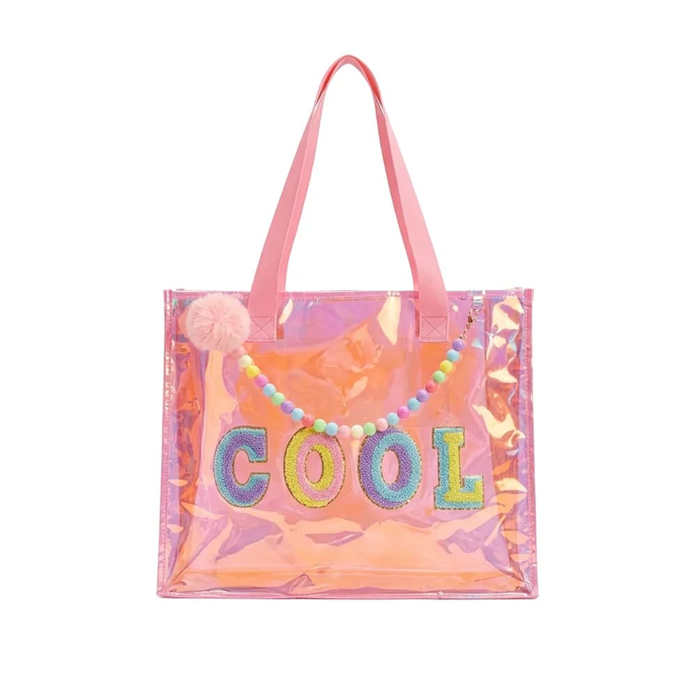 Peach holographic tote bag with the word COOL in glitter letters, a bead strap and a pom-pom